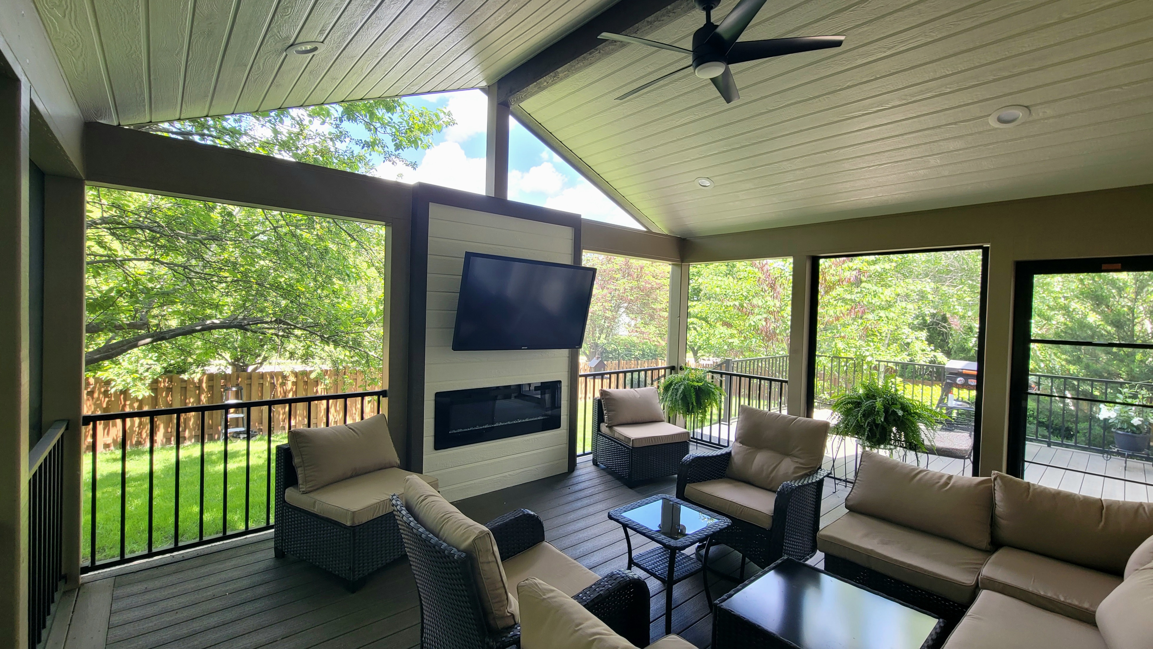 Screened porch with a cozy fireplace
