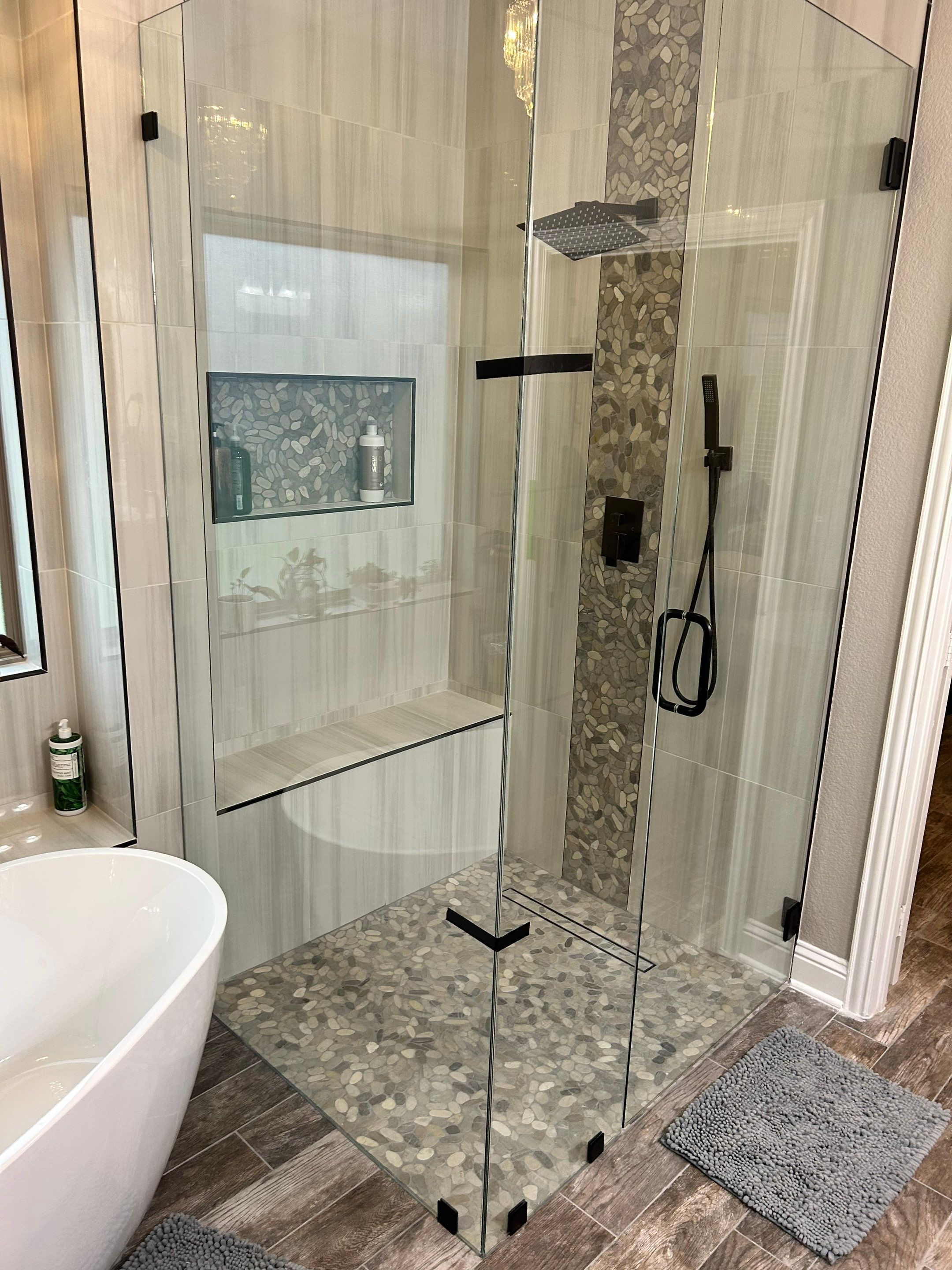 Walk-in shower with pebble tile floor